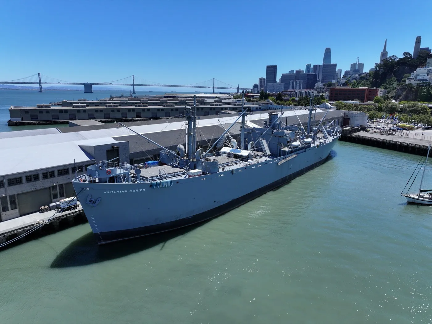 SS Jeremiah O'Brien aerial view with Bay Bridge and San Francisco skyline